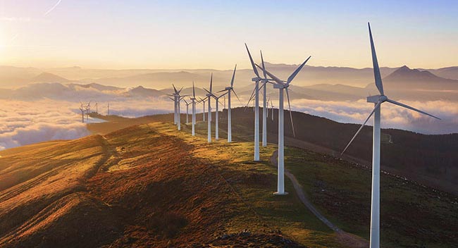 Wind turbines on a mountain during sunset