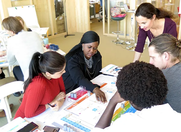 People playing Celemi Apples & Oranges building business acumen